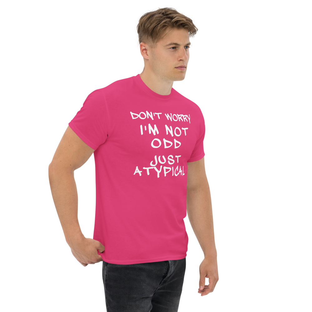 "Don't Worry I'm Not Odd Just Atypical" printed on a heliconia unisex classic tee worn by a male