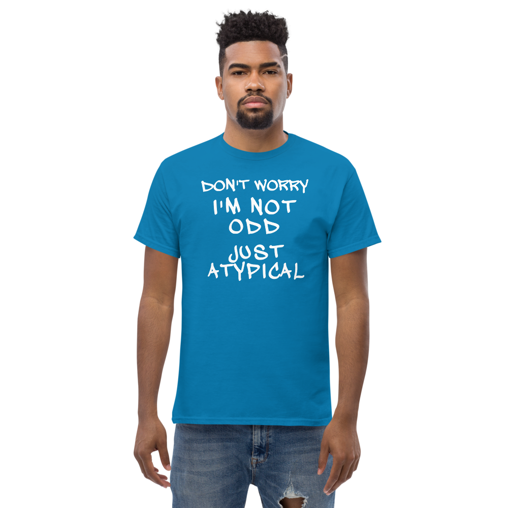 "Don't Worry I'm Not Odd Just Atypical" printed on a sapphire unisex classic tee worn by a male