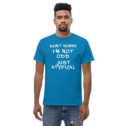 "Don't Worry I'm Not Odd Just Atypical" printed on a sapphire unisex classic tee worn by a male