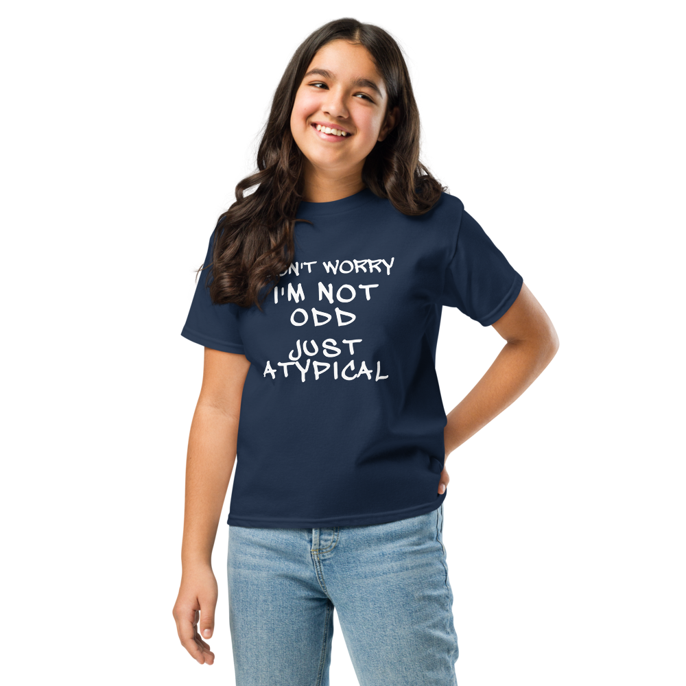 "Don't Worry I'm Not Odd Just Atypical" printed on a navy youth classic tee worn by a female