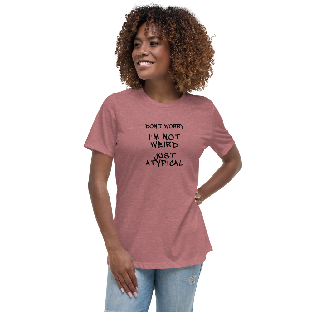 "Don't Worry I'm Not Weird Just Atypical" printed on a heather mauve women's relaxed t-shirt worn by a female