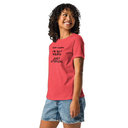 "Don't Worry I'm Not Weird Just Atypical" printed on a heather red women's relaxed t-shirt worn by a female