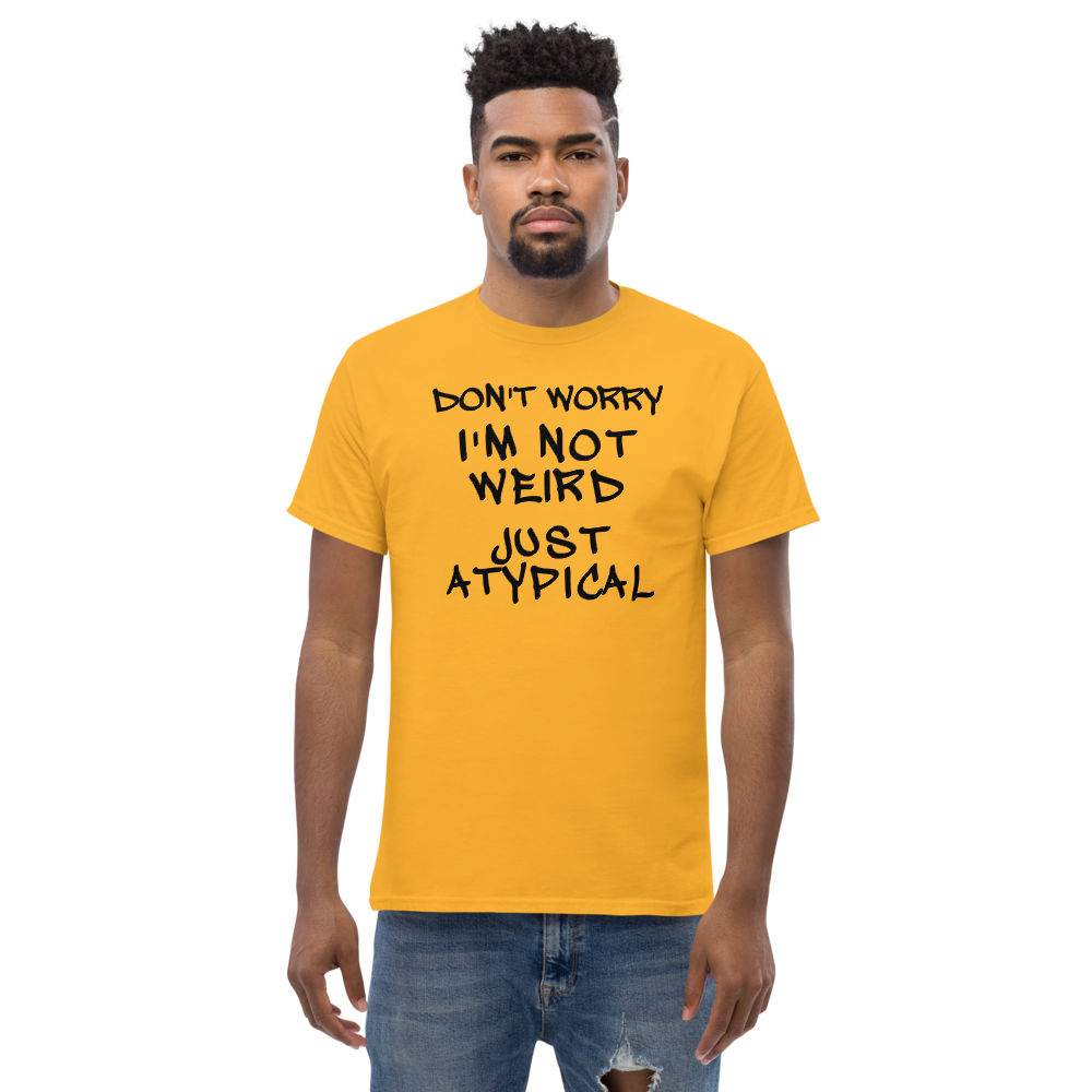 "Don't Worry I'm Not Weird Just Atypical" printed on a gold unisex classic tee worn by a male