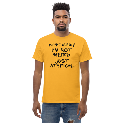 "Don't Worry I'm Not Weird Just Atypical" printed on a gold unisex classic tee worn by a male