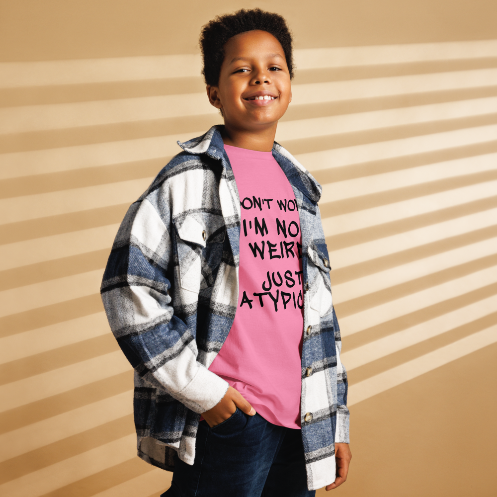 "Don't Worry I'm Not Weird Just Atypical" printed on a azalea youth classic tee worn by a male also wearing a jacket