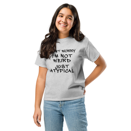"Don't Worry I'm Not Weird Just Atypical" printed on a sport grey youth classic tee worn by a female