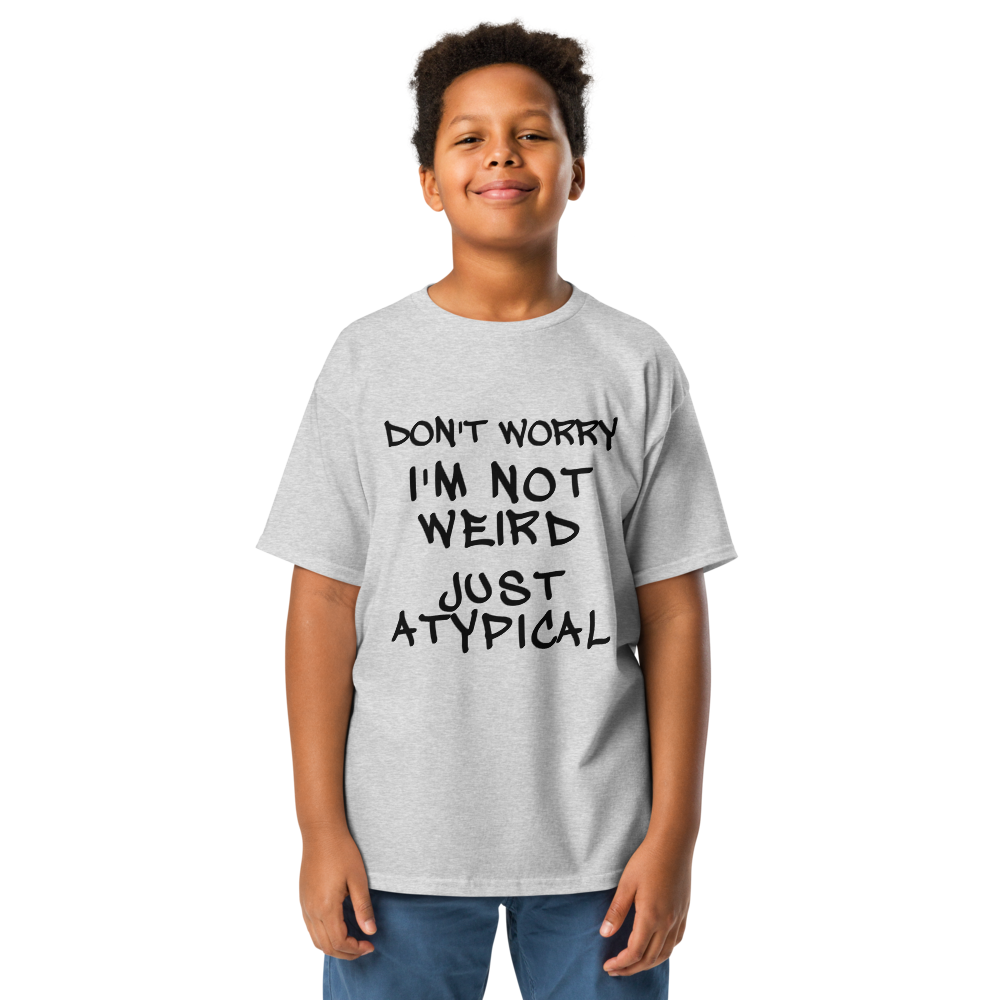 "Don't Worry I'm Not Weird Just Atypical" printed on a sport grey youth classic tee worn by a male