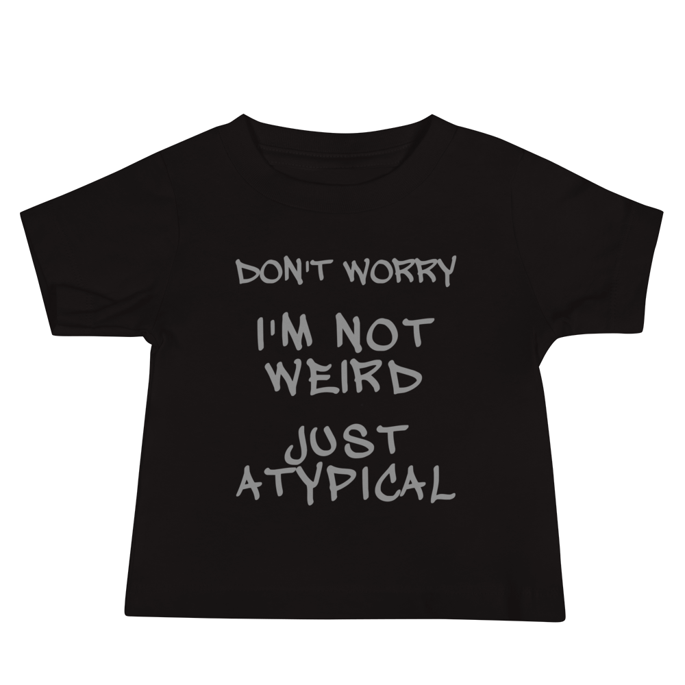 "Don't Worry I'm Not Weird Just Atypical" printed on a black baby jersey short sleeve tee laying on a flat surface