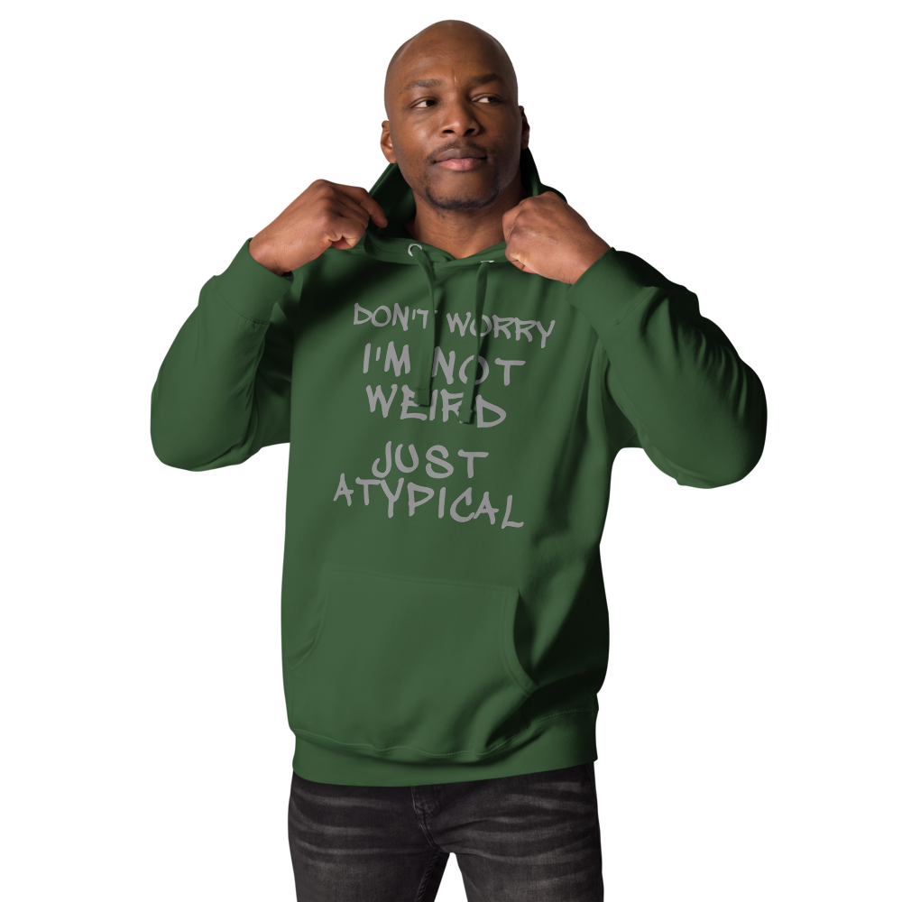 "Don't Worry I'm Not Weird Just Atypical" printed on a forest green unisex hoodie worn by a male