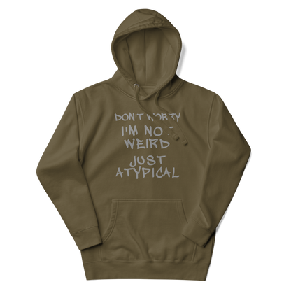 "Don't Worry I'm Not Weird Just Atypical" printed on a military green unisex hoodie laying on a flat surface with the hood up