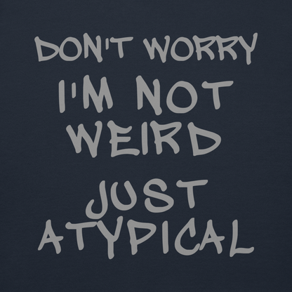 "Don't Worry I'm Not Weird Just Atypical" printed on a navy blazer background