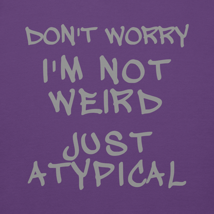"Don't Worry I'm Not Weird Just Atypical" printed on a purple background