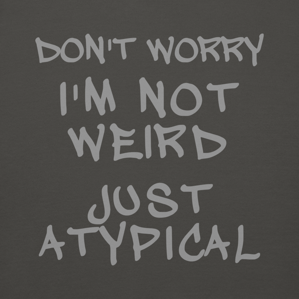 "Don't Worry I'm Not Weird Just Atypical" printed on a vintage black background