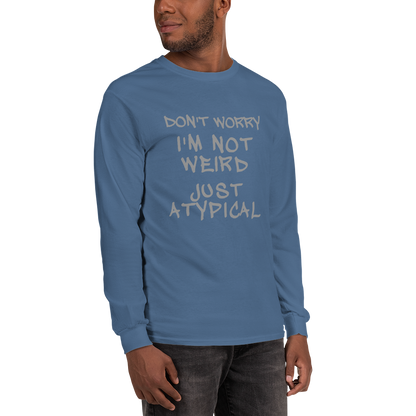 "Don't Worry I'm Not Weird Just Atypical" printed on a indigo blue men's long sleeve shirt worn by a male