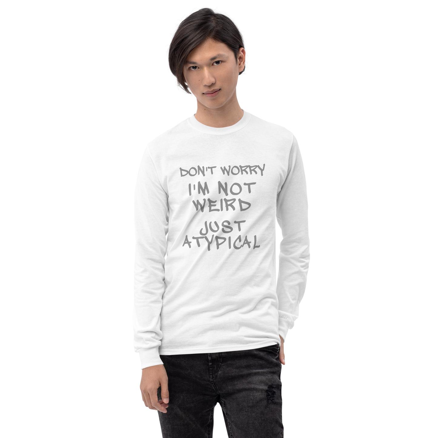 "Don't Worry I'm Not Weird Just Atypical" printed on a white men's long sleeve shirt worn by a male