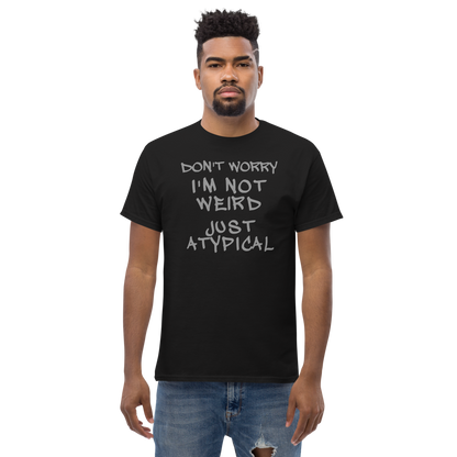 "Don't Worry I'm Not Weird Just Atypical" printed on a black unisex classic tee worn by a male