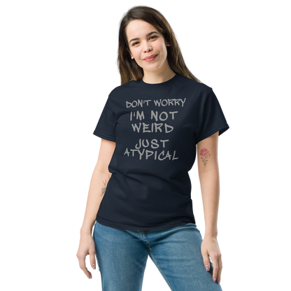 "Don't Worry I'm Not Weird Just Atypical" printed on a navy unisex classic tee worn by a female