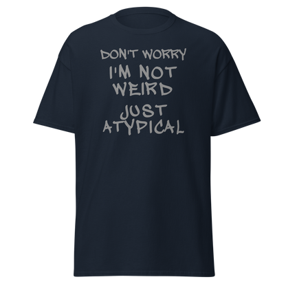 "Don't Worry I'm Not Weird Just Atypical" printed on a navy unisex classic tee laying on a flat surface