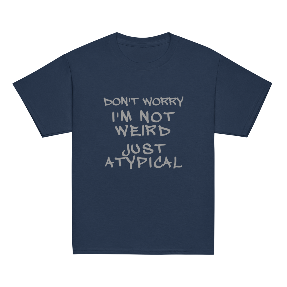 "Don't Worry I'm Not Weird Just Atypical" printed on a navy youth classic tee laying on a flat surface
