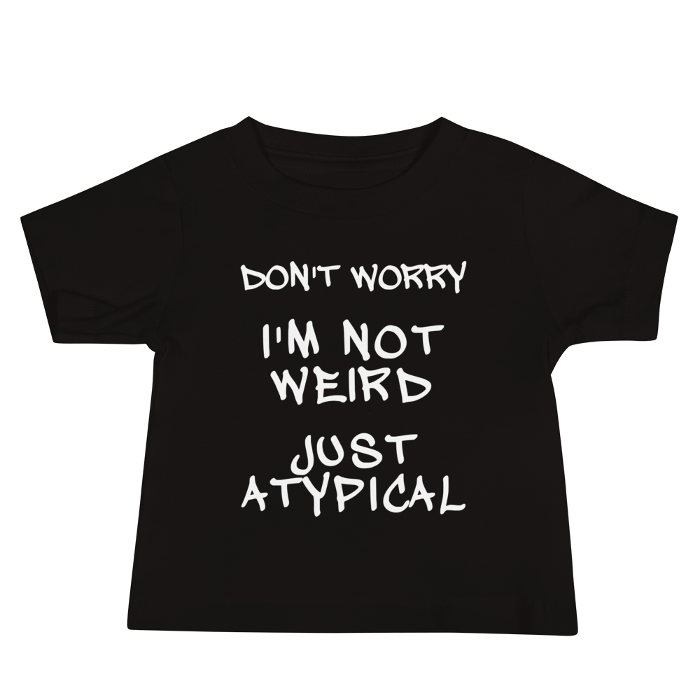 "Don't Worry I'm Not Weird Just Atypical" printed on a black baby jersey short sleeve tee laying on a flat surface