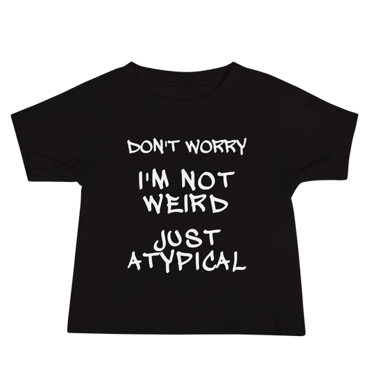 "Don't Worry I'm Not Weird Just Atypical" printed on a black baby jersey short sleeve tee laying on a flat surface