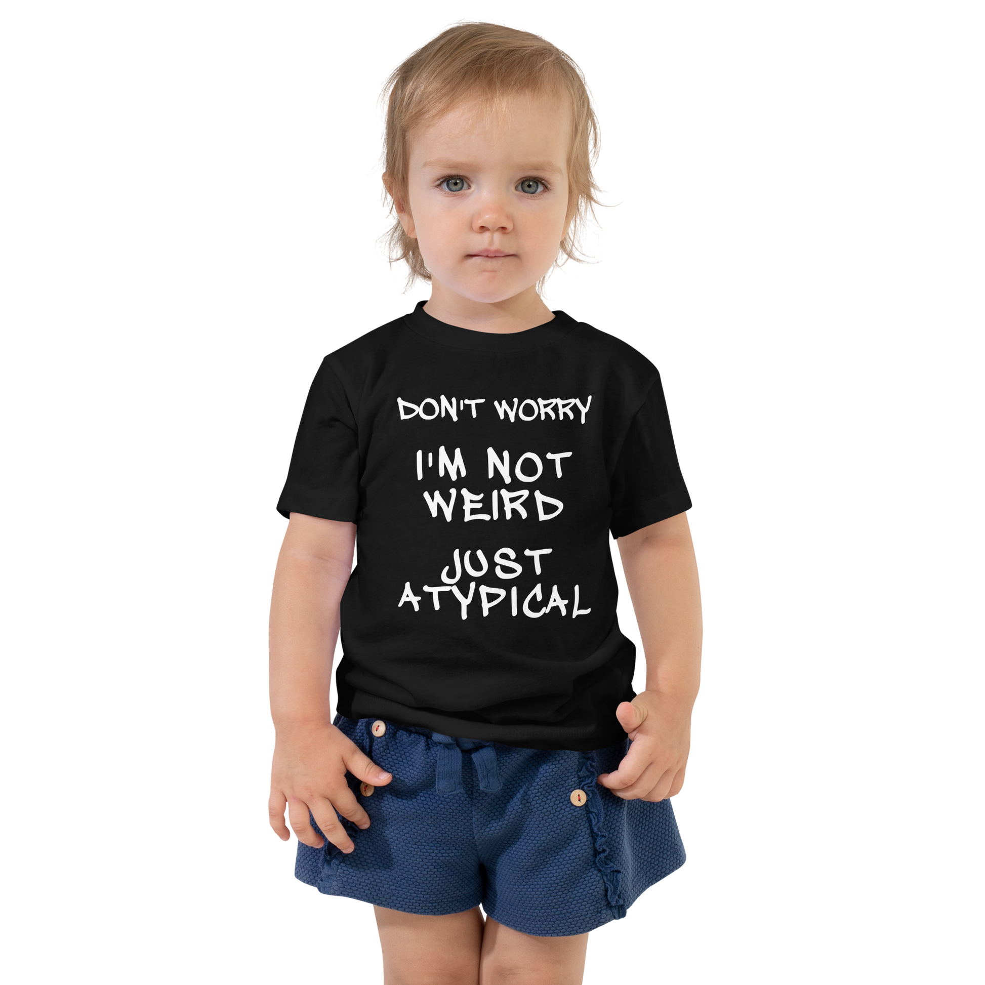 "Don't Worry I'm Not Weird Just Atypical" printed on a black toddler short sleeve tee worn by a female