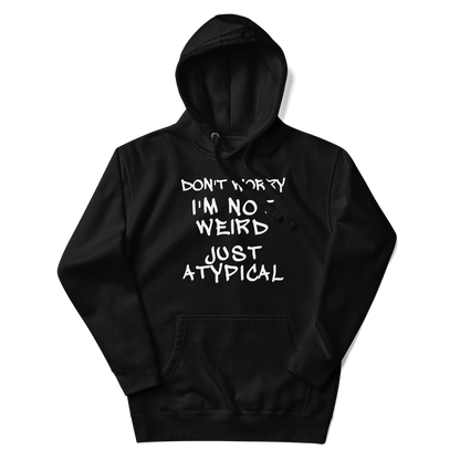 "Don't Worry I'm Not Weird Just Atypical" printed on a black unisex hoodie laying on a flat surface with the hood up