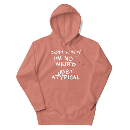 "Don't Worry I'm Not Weird Just Atypical" printed on a dusty rose unisex hoodie laying on a flat surface with the hood up