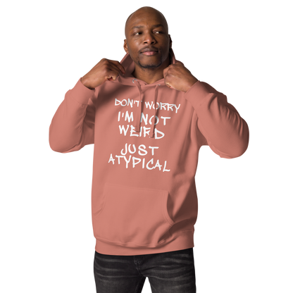 "Don't Worry I'm Not Weird Just Atypical" printed on a dusty rose unisex hoodie worn by a male