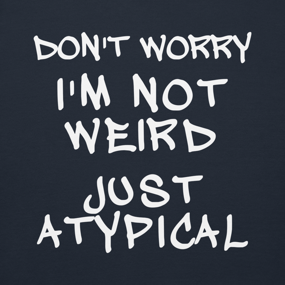 "Don't Worry I'm Not Weird Just Atypical" printed on a navy blazer background