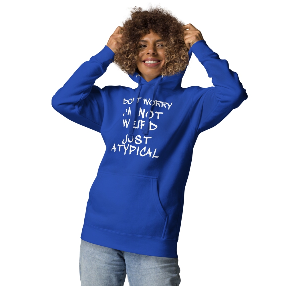 "Don't Worry I'm Not Weird Just Atypical" printed on a team royal unisex hoodie worn by a female