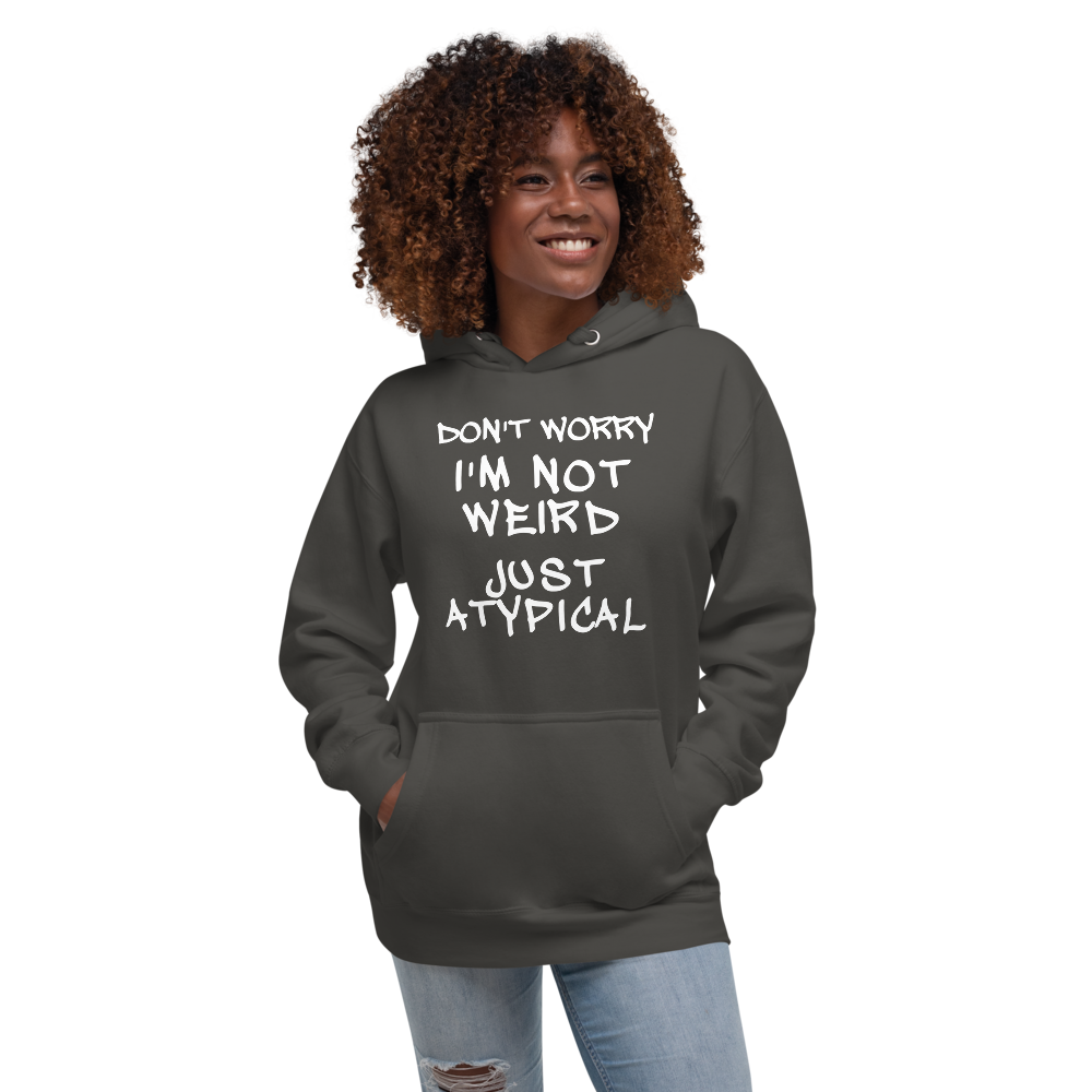 "Don't Worry I'm Not Weird Just Atypical" printed on a vintage black unisex hoodie worn by a female