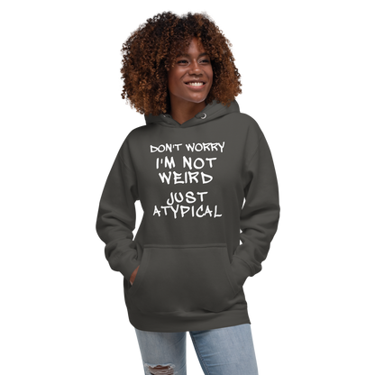 "Don't Worry I'm Not Weird Just Atypical" printed on a vintage black unisex hoodie worn by a female