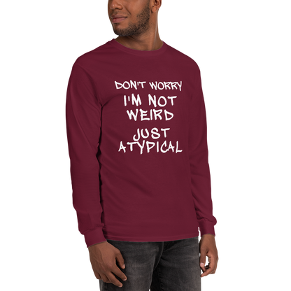 "Don't Worry I'm Not Weird Just Atypical" printed on a maroon men's long sleeve shirt worn by a male