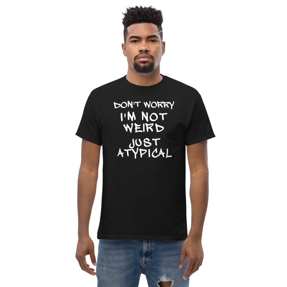 "Don't Worry I'm Not Weird Just Atypical" printed on a black unisex classic tee worn by a male
