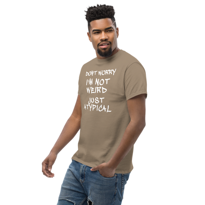 "Don't Worry I'm Not Weird Just Atypical" printed on a brown savana unisex classic tee worn by a male