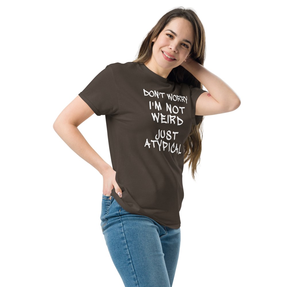 "Don't Worry I'm Not Weird Just Atypical" printed on a dark chocolate unisex classic tee worn by a female