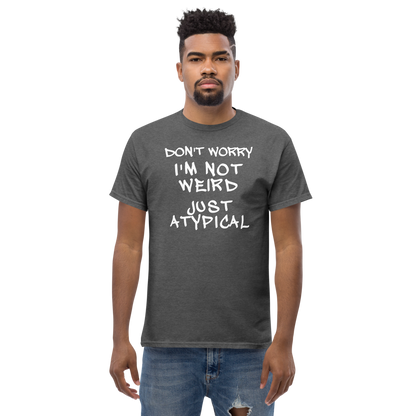 "Don't Worry I'm Not Weird Just Atypical" printed on a dark heather unisex classic tee worn by a male