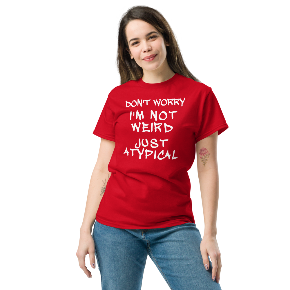 "Don't Worry I'm Not Weird Just Atypical" printed on a red unisex classic tee worn by a female