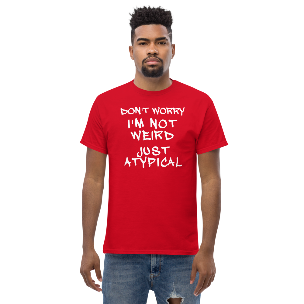 "Don't Worry I'm Not Weird Just Atypical" printed on a red unisex classic tee worn by a male