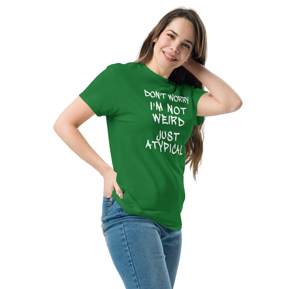 "Don't Worry I'm Not Weird Just Atypical" printed on a turf green unisex classic tee worn by a female