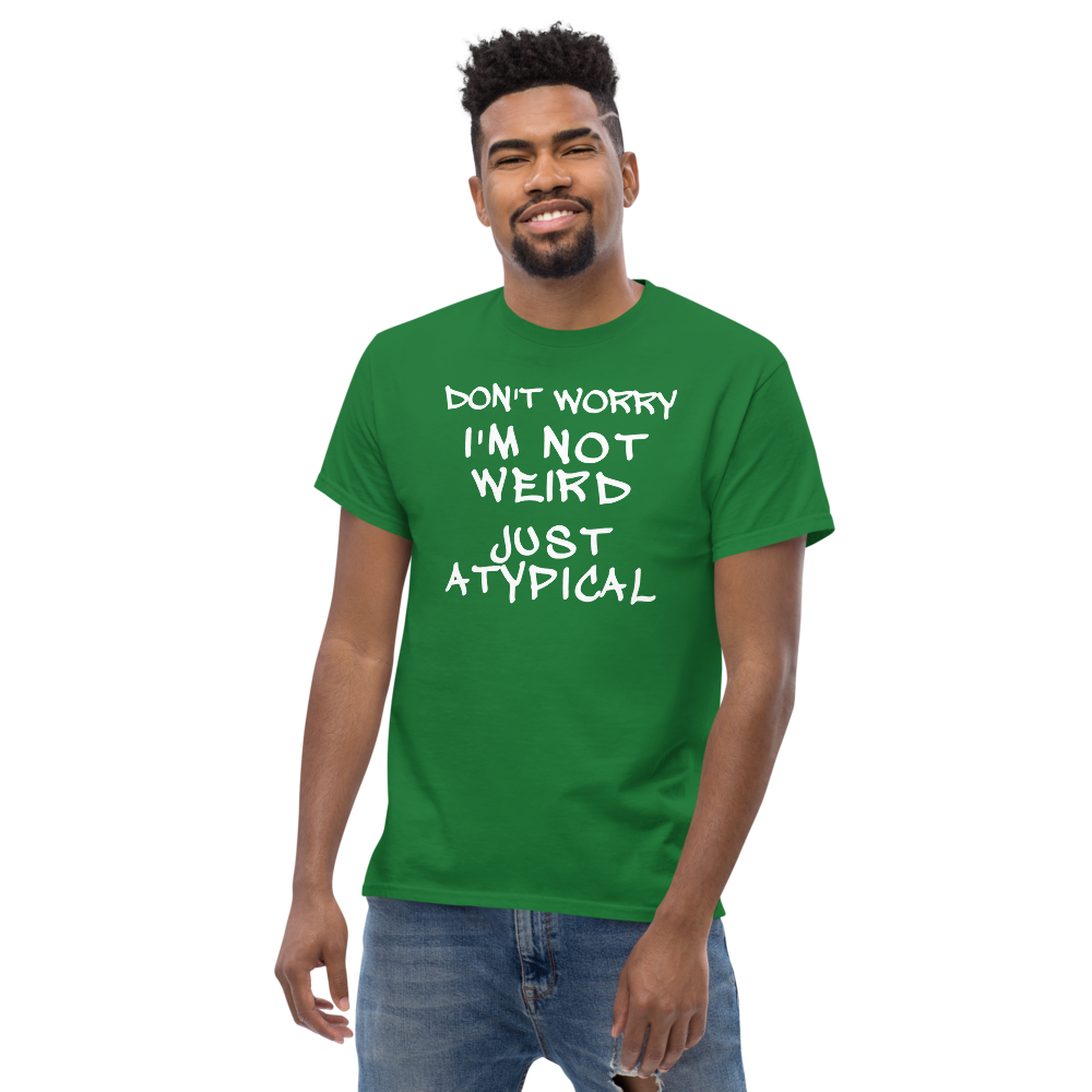 "Don't Worry I'm Not Weird Just Atypical" printed on a turf green unisex classic tee worn by a male