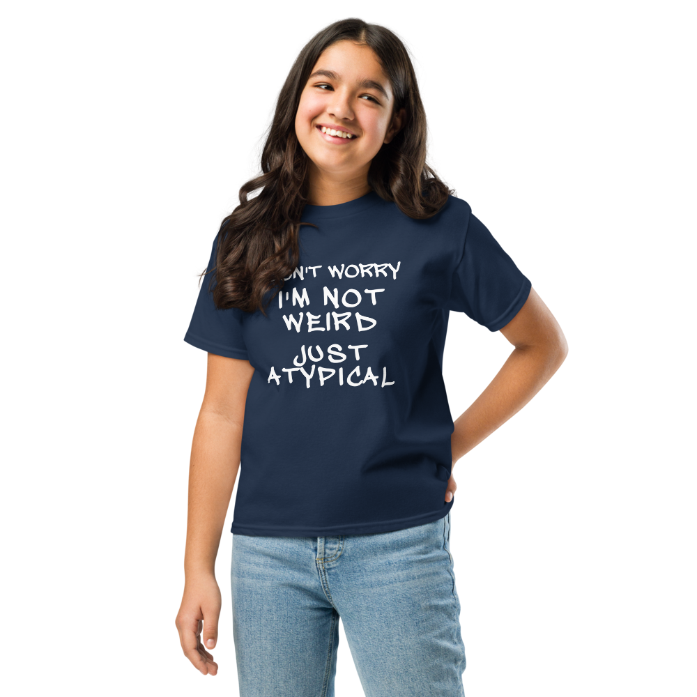 "Don't Worry I'm Not Weird Just Atypical" printed on a navy youth classic tee worn by a female