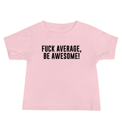 "Fuck Average, Be Awesome!" printed on a pink baby jersey short sleeve tee laying on a flat surface