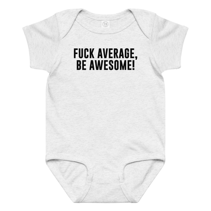 "Fuck Average, Be Awesome!" printed on a ash baby jersey bodysuit laying on a flat surface amongst other clothes