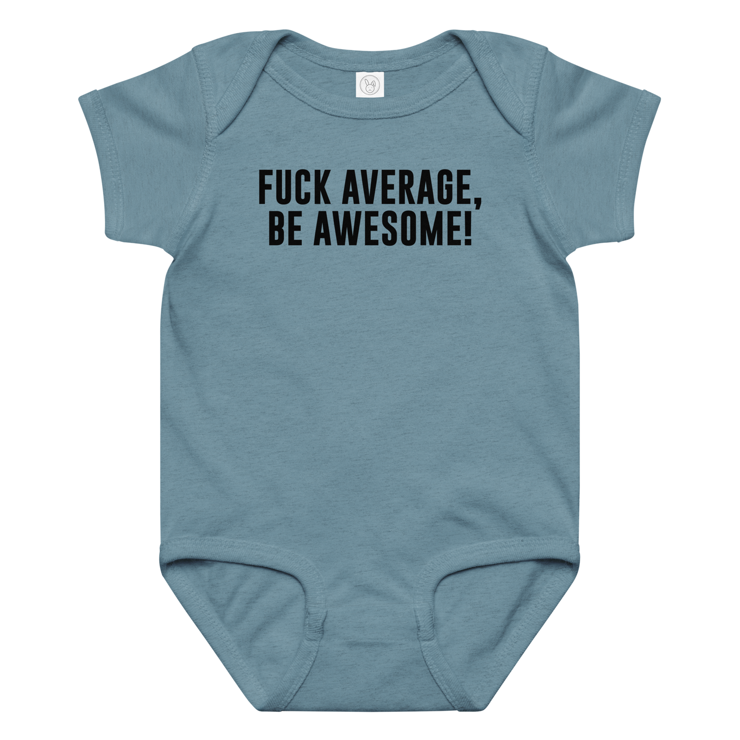 "Fuck Average, Be Awesome!" printed on a vintage indigo baby jersey bodysuit laying on a flat surface amongst other clothes