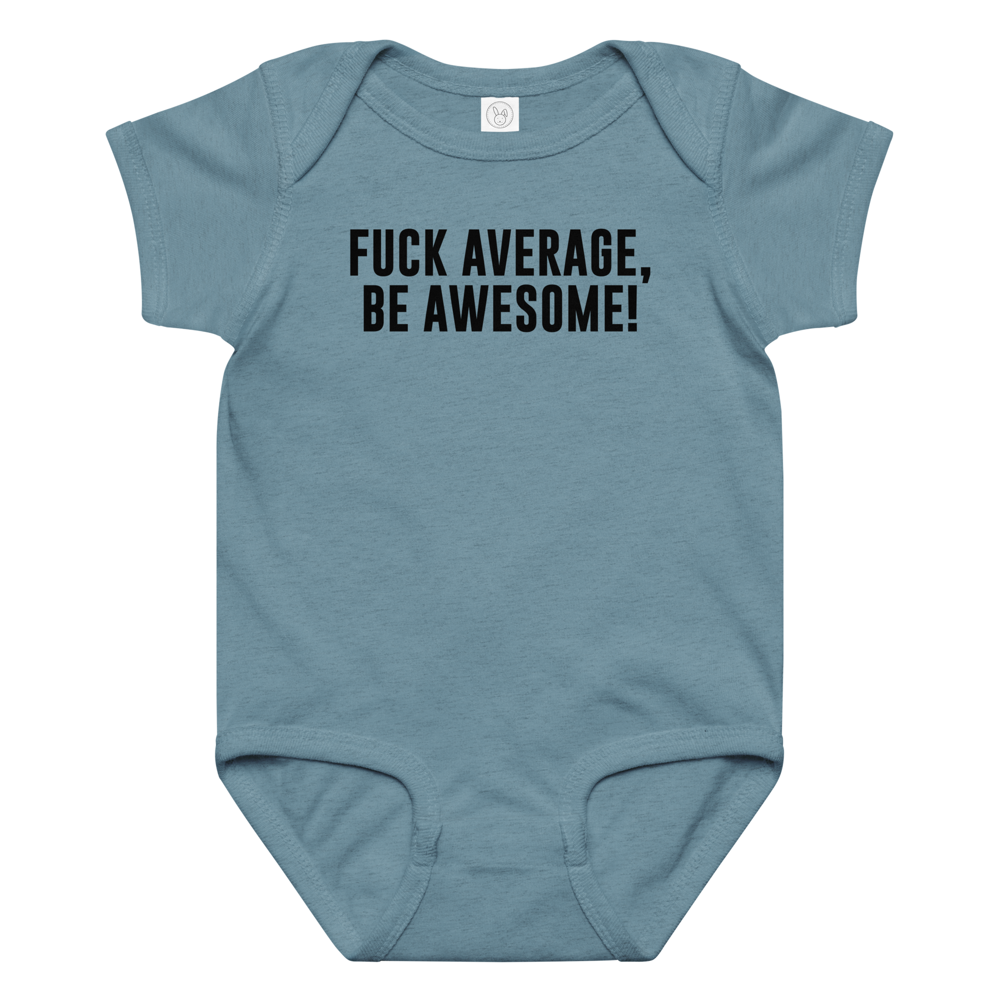 "Fuck Average, Be Awesome!" printed on a vintage indigo baby jersey bodysuit laying on a flat surface amongst other clothes