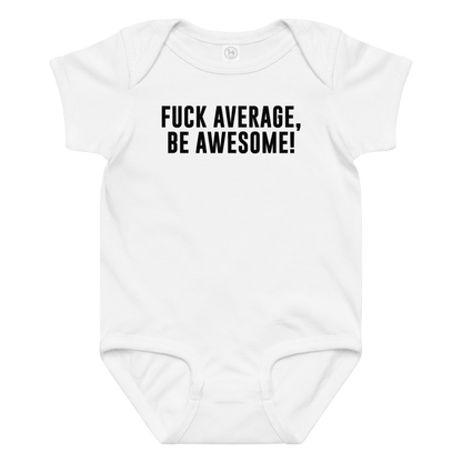 "Fuck Average, Be Awesome!" printed on a white baby jersey bodysuit laying on a flat surface amongst other clothes