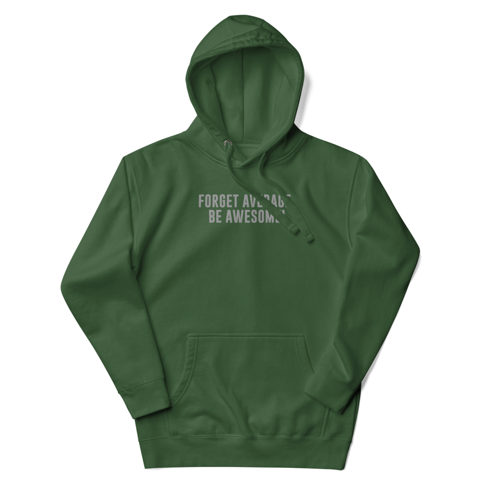 "Forget Average, Be Awesome!" printed on a forest green unisex hoodie laying on a flat surface with the hood up
