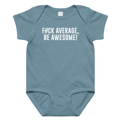 "F#Ck Average, Be Awesome!" printed on a vintage indigo baby jersey bodysuit laying on a flat surface amongst other clothes